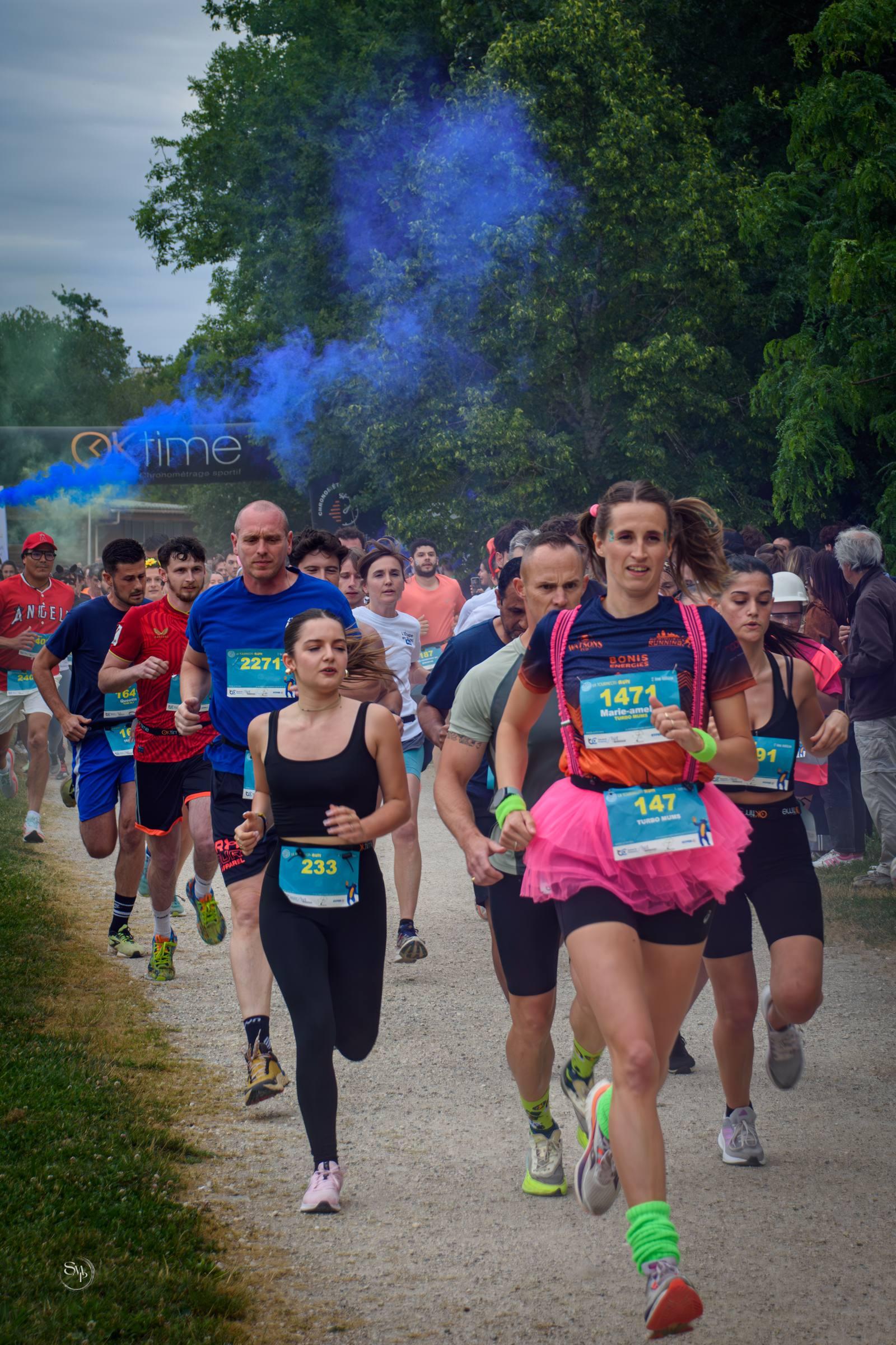 Passage de témoin entre deux relayeurs dans la zone de transition